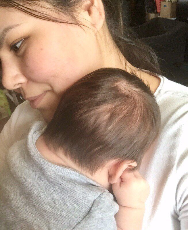 Attawapiskat resident Chelsea Edwards holds her four-month-old son.