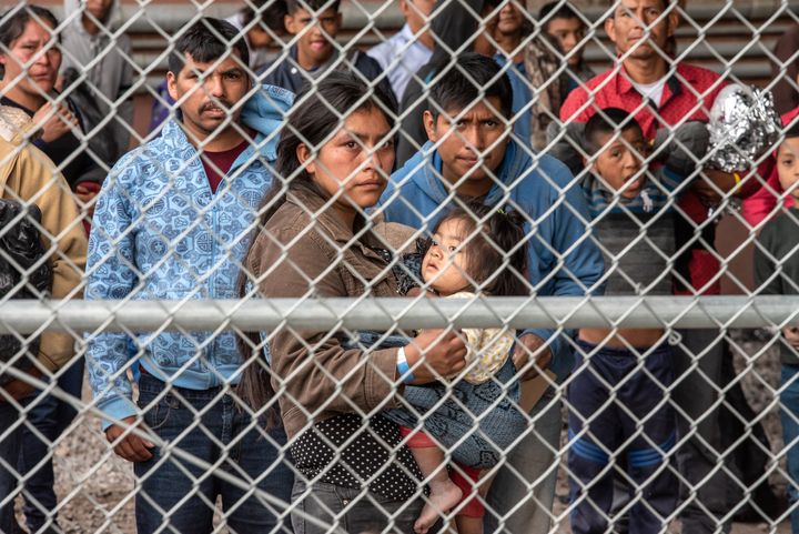 DMigrants are gathered inside the fence of a makeshift detention center in El Paso, Texas on Wed. March 27, 2019. (Photo by Sergio Flores for The Washington Post via Getty Images)