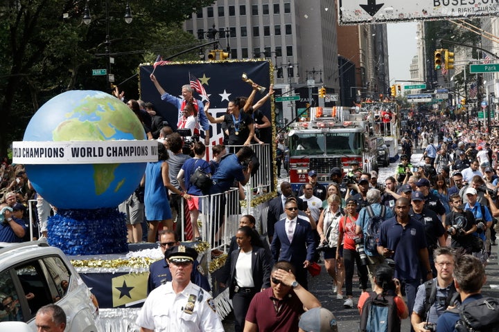 A float with members of the U.S. women's soccer team and New York Mayor Bill de Blasio, rear, makes its way up Broadway in a ticker tape parade along the Canyon of Heroes, Wednesday, July 10, 2019, in New York.