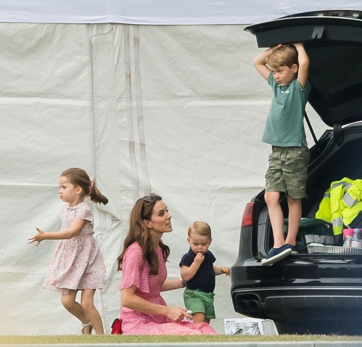The Duchess of Cambridge with Charlotte, Louis and George (left to right) at the King Power Royal Charity Polo Day at Billingbear Polo Club.