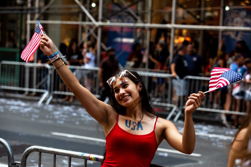 Fans celebrate the U.S. women's soccer team as they make their way up Broadway's Canyon of Heroes.