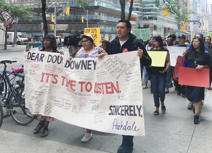 Protestors gathered outside of the Ministry of the Attorney General on Tuesday to speak out against cuts to Legal Aid Ontario.
