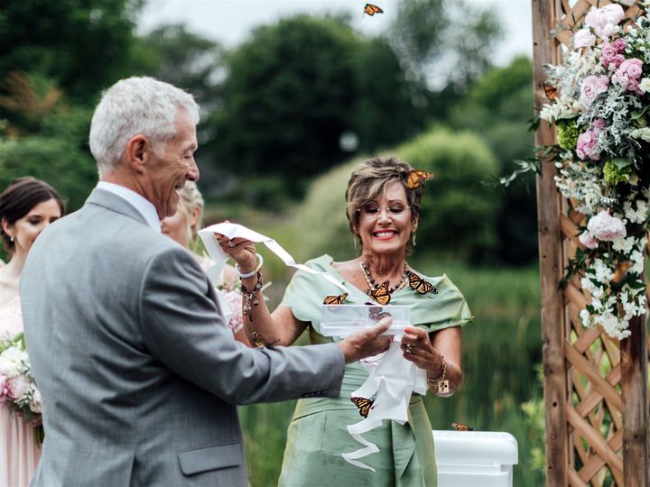 "As they released the butterflies, they wouldn’t fly off," photographer Jessica Mann said in a now-viral Facebook post.