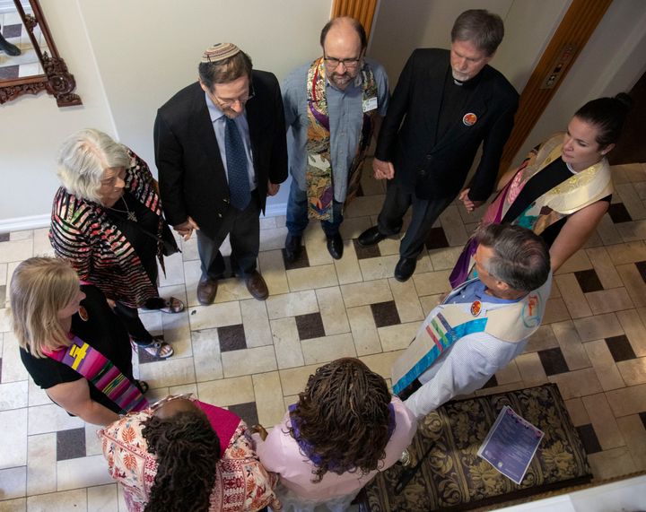 Clergy from several faiths gather to offer a blessing on July 9, 2019, at Whole Woman’s Health of Austin, Texas, which provides abortion care and other gynecological services.