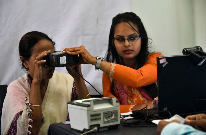 A woman scanning her eyes at an Aadhar registration office in Guwahati on 8 October 2018. 