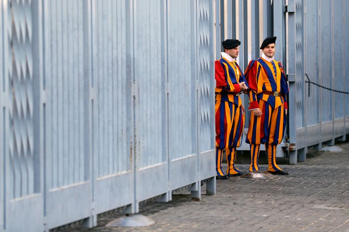 Vatican Swiss Guards stand at the Sant'Uffizio entrance to the Vatican