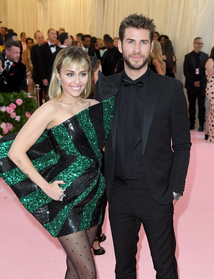 Miley Cyrus and Liam Hemsworth arrive for the 2019 Met Gala celebrating Camp: Notes on Fashion at the Metropolitan Museum of Art on May 6, 2019 in New York City.