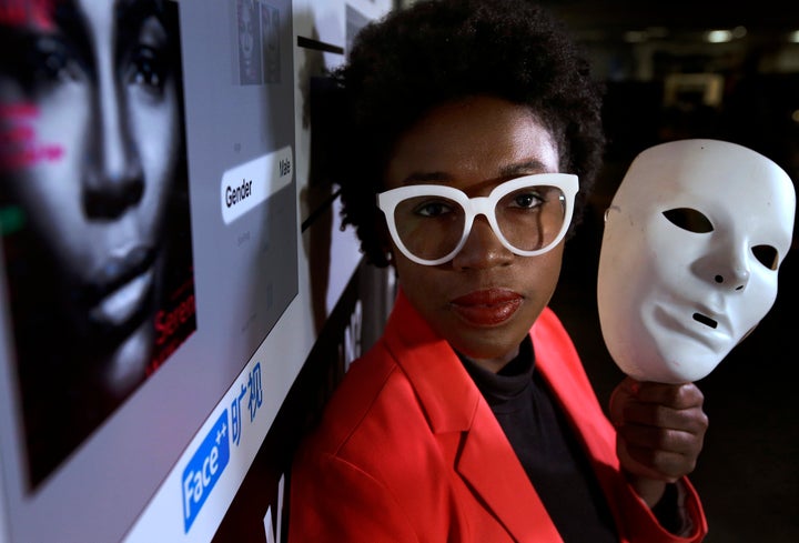 Joy Buolamwini, a facial recognition researcher at the Massachusetts Institute of Technology, has found racial and gender bias in facial analysis tools. The technology has a hard time recognizing certain faces, especially darker-skinned women. In the photo, Buolamwini holds up a white mask she had to use so that the software could detect her face.