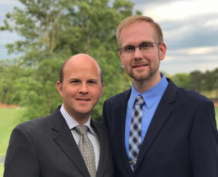 Joshua Payne-Elliott (right) and his husband, Layton Payne-Elliott, were both employed as Catholic school teachers in Indianapolis. Joshua Payne-Elliott was fired from his job last month.