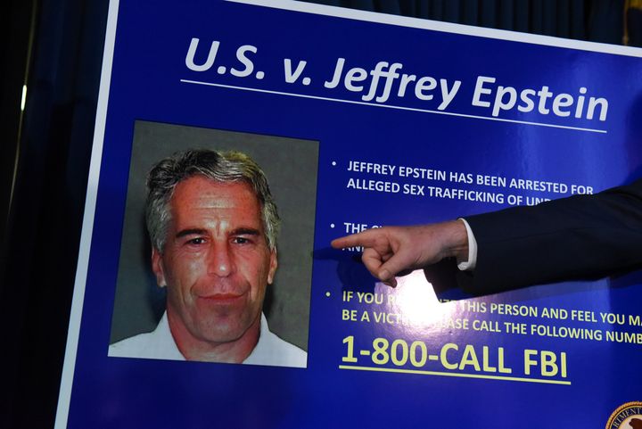 A prosecutor points to a photograph of Jeffrey Epstein at a July 2019 news conference in New York City.