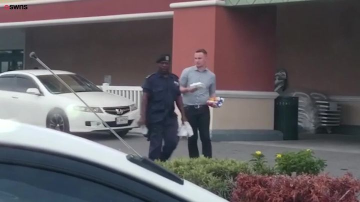 Lee Martin-Cramp, seen here walking with a police officer in Antigua, has been jailed 