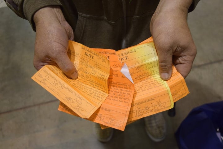 ‘J’ displays a small portion of his 72-hour relocation sticker collection, each warning of an impending impound. J is a vehicle resident and ‘car rancher’ – a person who lends or rents multiple vehicles to otherwise unsheltered people. April 29, 2014.