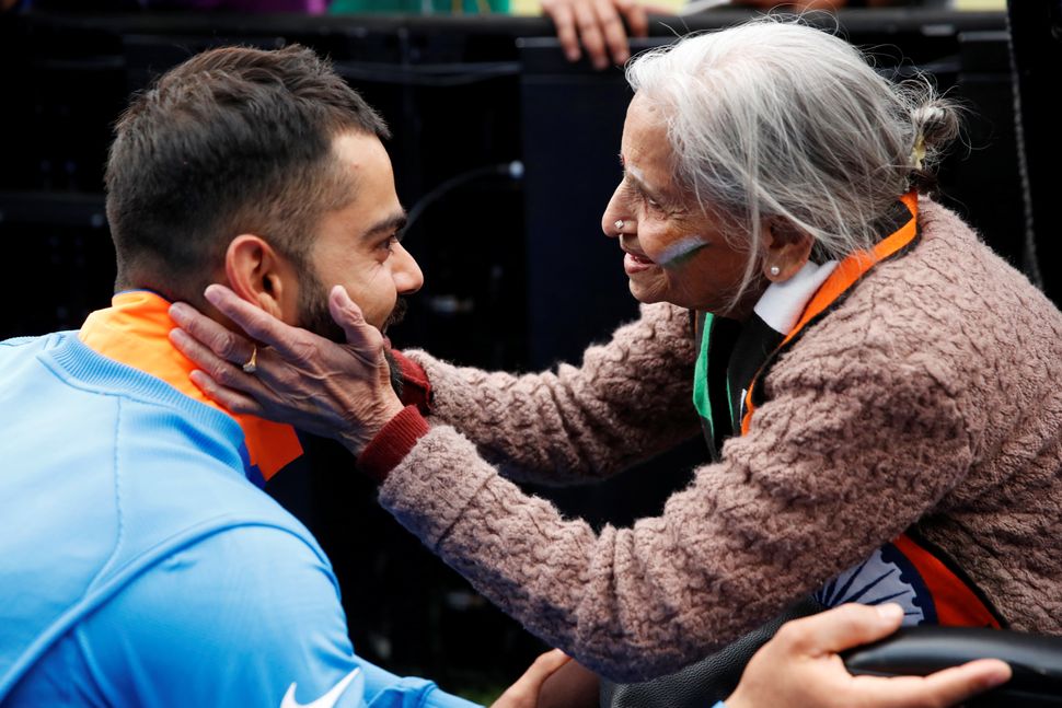 Charulata Patel, an Indian cricket fan, meets Virat Kohli after a World Cup cricket match. 