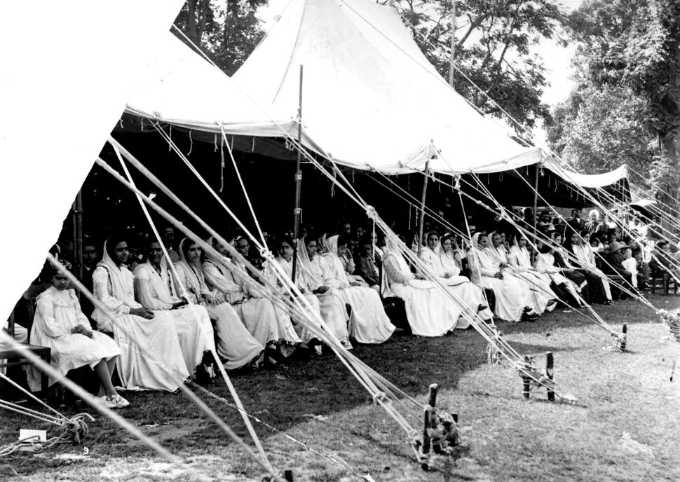 Parsi women watch a cricket match in India, circa 1910.