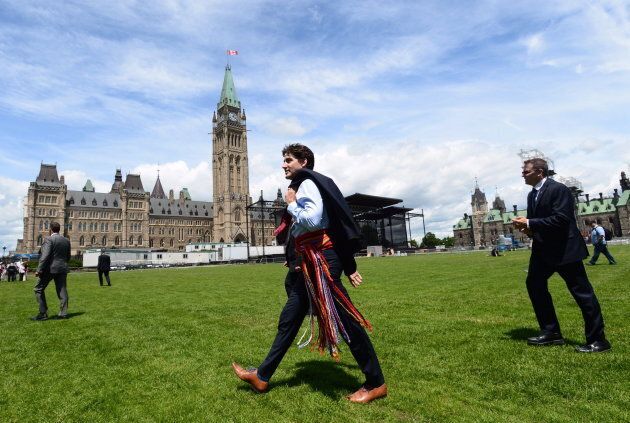 Prime Minister Justin Trudeau walks to Parliament following a National Indigenous Peoples Day announcement in Ottawa on June 21, 2017. Trudeau campaigned with a promise to forge a new nation-to-nation relationship with Indigenous Peoples.