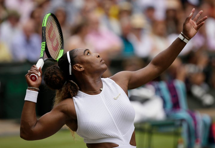 Serena Williams serves to Romania's Simona Halep during the women's singles final match. (AP Photo/Tim Ireland)