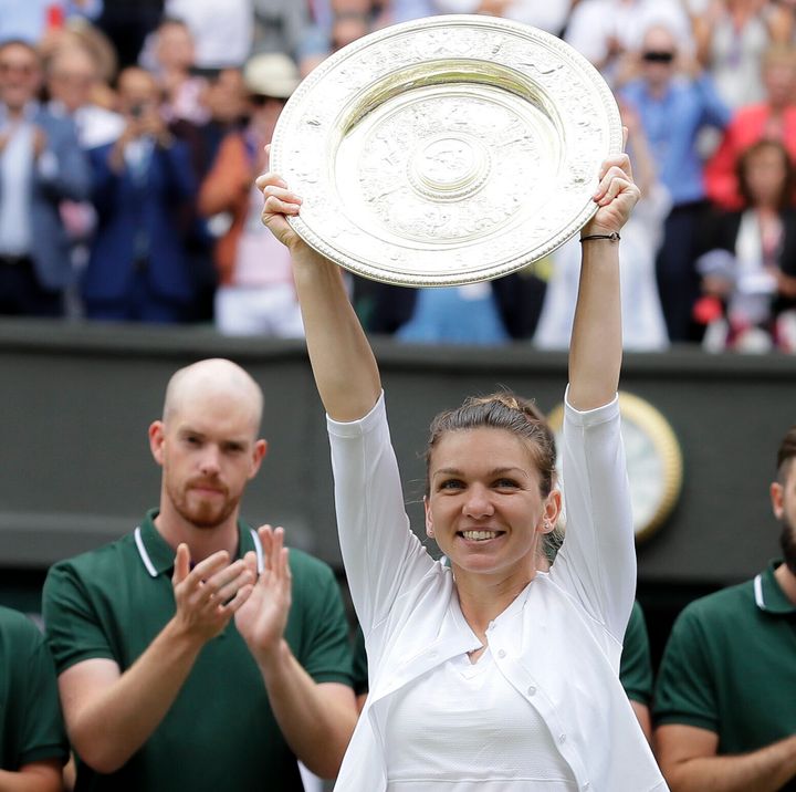 Simona Halep holds up her her trophy after the match.