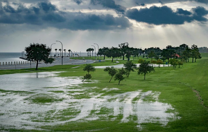 The sky is cloudy as over Lake Pontchartrain on Lakeshore Drive as little flooding is reported in New Orleans, ahead of Tropical Storm Barry making landfall on Saturday, July 13, 2019. (AP Photo/Matthew Hinton) 