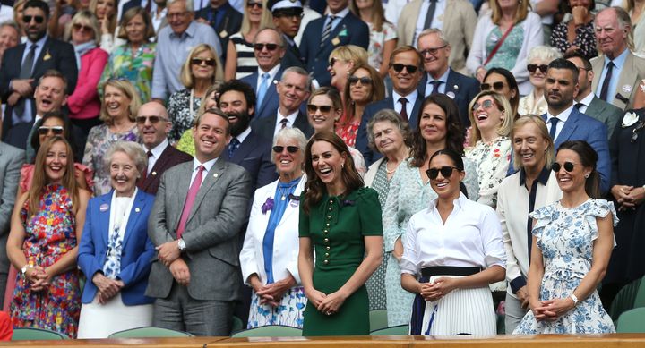 The Duchess of Cambridge and the Duchess of Sussex and Pippa Middleton Matthews share a laugh with others during the women's singles final at Wimbledon on Saturday, July 13, 2019.