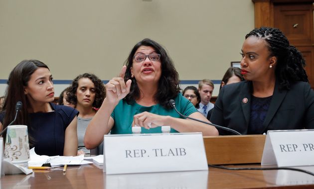 Rashida Tlaib, centre, Alexandria Ocasio-Cortez, left, and Ayanna Pressley, 