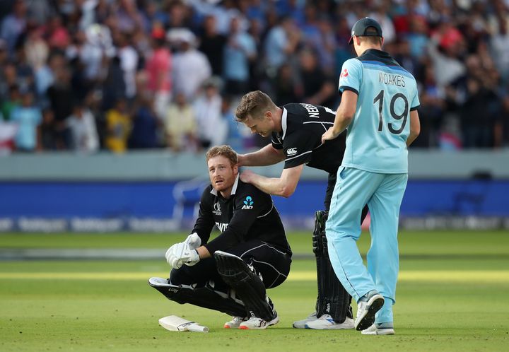 New Zealand's Martin Guptill is consoled by teammate James Neesham after England win the World Cup.