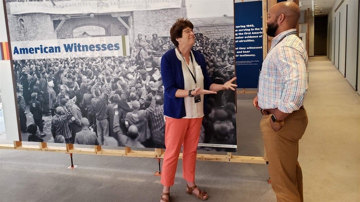 Kim Kenneson of Johnson City, Tennessee, and Nicholas Turner of Zachary, Louisiana, at the U.S. Holocaust Memorial Museum in Washington, D.C. The teachers discuss techniques of teaching the Holocaust in front of a mural about the American reaction to the Holocaust. A growing number of states are requiring Holocaust education, as survivors die and hate crimes rise.The Pew Charitable Trusts