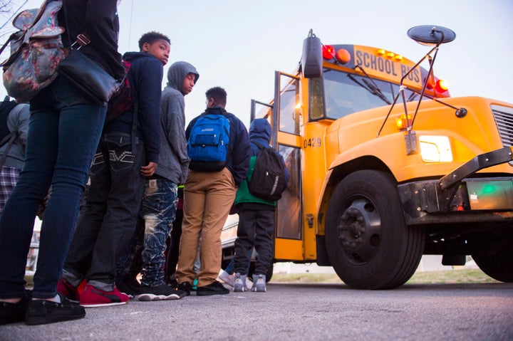 Students board a bus heading to Atherton High School on March, 2, 2017, in Louisville, Kentucky.