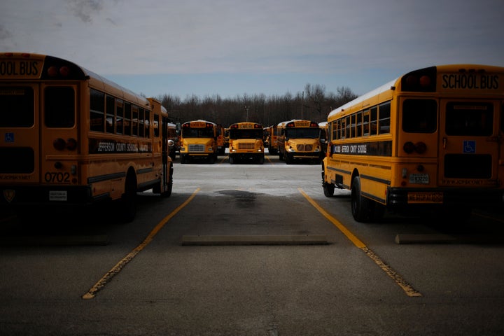 School buses at a compound for the Jefferson County Public Schools.