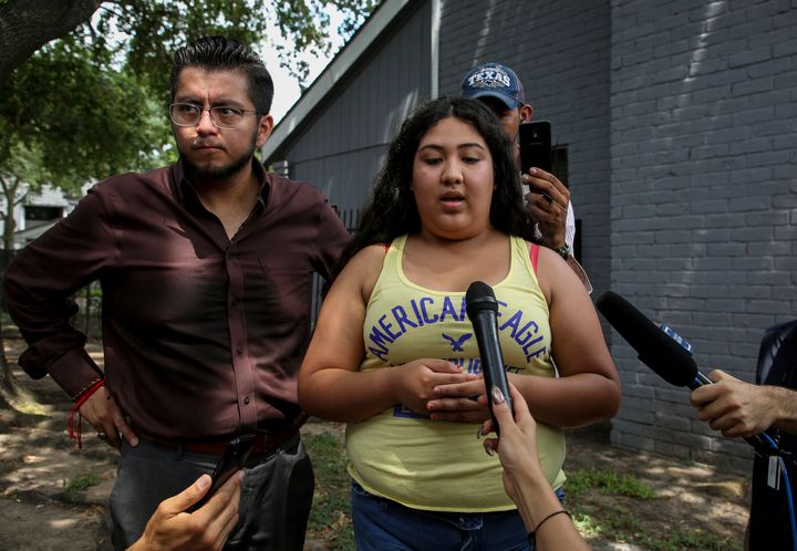 Kaylin Garcia talks to reporters about the early morning raid that was conducted by Immigration and Customs Enforcement (ICE) agents at the El Paraiso Apartments complex in Houston, Texas, Monday, July 15, 2019.