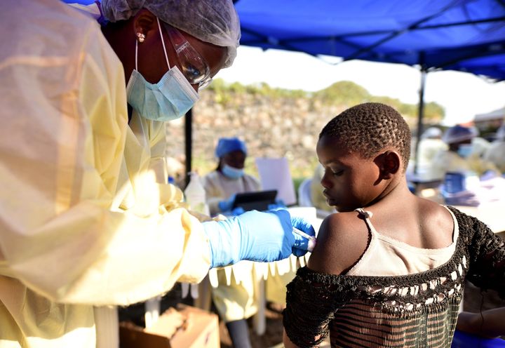 A Congolese health worker administers ebola vaccine to a child at the Himbi Health Centre in Goma, Democratic Republic of Congo.