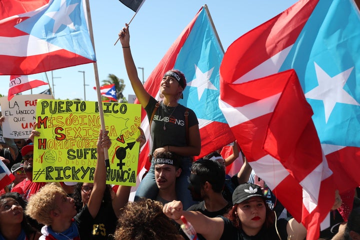 Demonstrators protest against Gov. Ricardo Rosselló on Wednesday in front of the Capitol Building in Old San Juan.