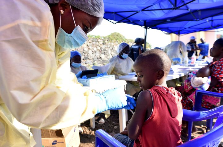A Congolese health worker administers ebola vaccine to a child at the Himbi Health Centre in Goma, Democratic Republic of Congo, on July 17.