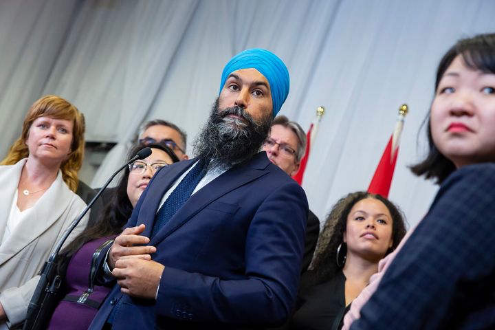 NDP Leader Jagmeet Singh, surrounded by fellow party-members, speaks to the media following a speech at the Ontario NDP Convention in Hamilton, Ont. on June 16, 2019.
