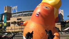 Cosplayers Pay Their Respects To Trump Baby Blimp At Comic-Con