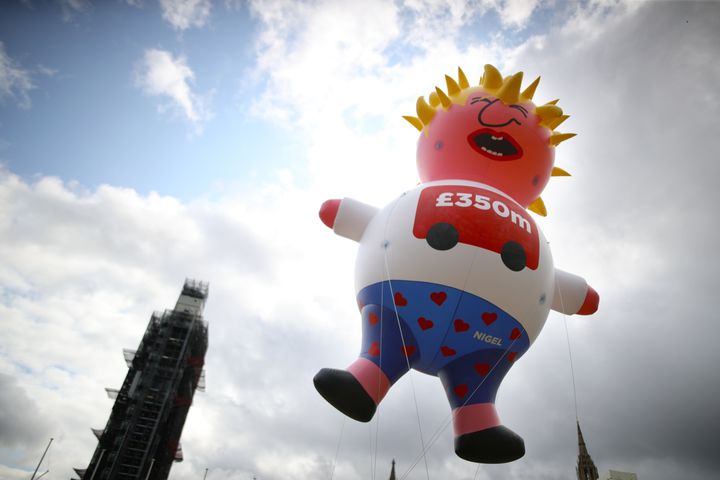 A blimp depicting Boris Johnson is being prepared to be launched in Parliament Square 