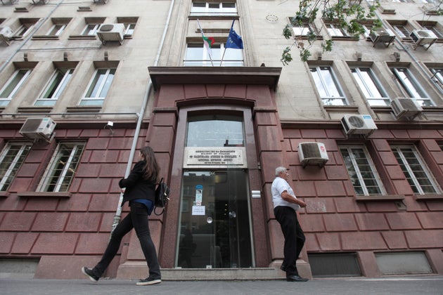 People walk outside Bulgaria's National Revenue Agency building in Sofia,