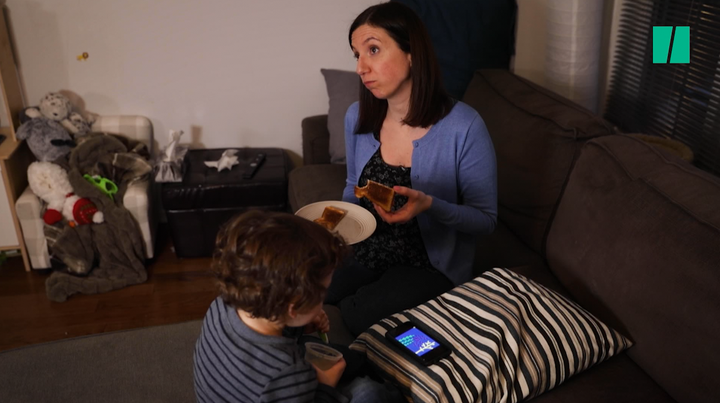 Natalie Stechyson and her son enjoy some quality screen time and bread.