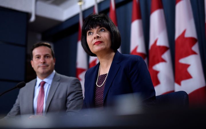 Health Minister Ginette Petitpas Taylor and Liberal MP Marco Mendicino, left, speak at a press conference at the National Press Theatre in Ottawa on July 22, 2019.