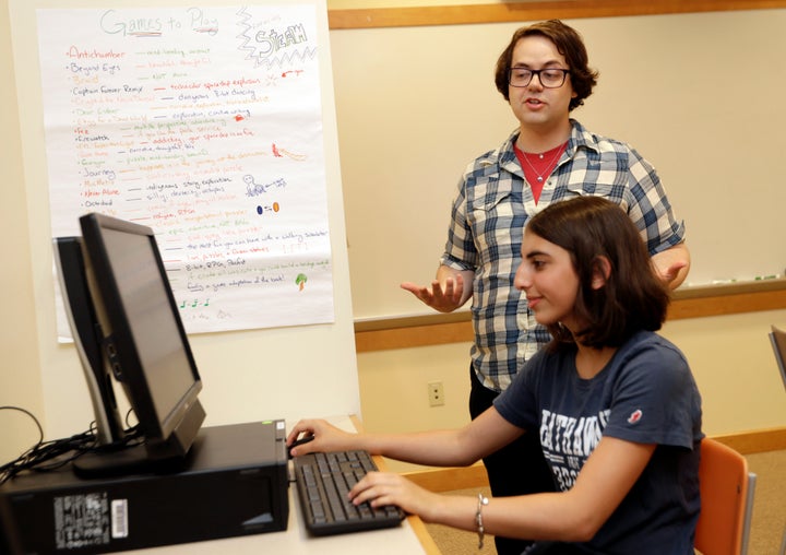 Coach J Collins watches Kaila Morris play "Heroes of the Storm," at Hathaway Brown School, Wednesday, July 10, 2019, in Shaker Heights, Ohio.