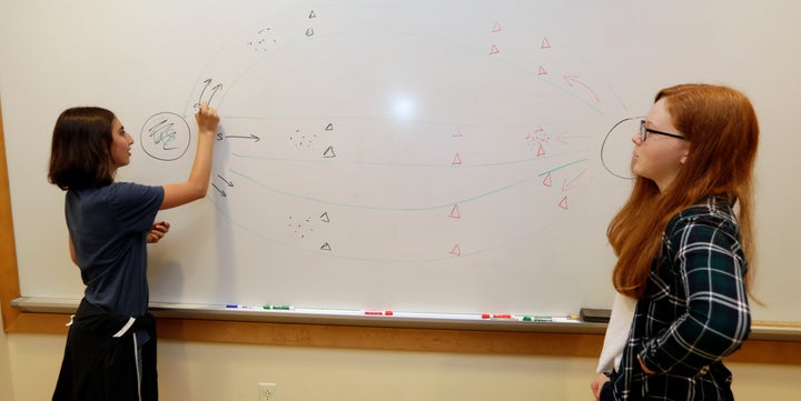 Kaila Morris, left, and Claire Hofstra plan out a strategy on the computer game "Heroes of the Storm," at Hathaway Brown Scho