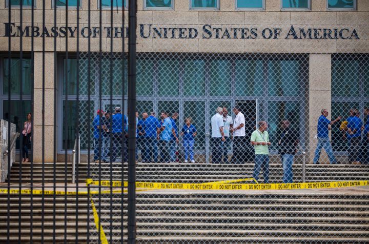 Staff stand within the United States embassy facility in Havana, Cuba, Friday, Sept. 29, 2017. 
