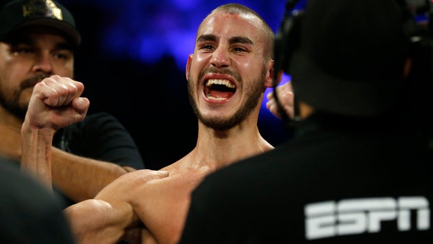 Maxim Dadashev celebrates after being declared the winner of a super lightweight bout in Las Vegas in...