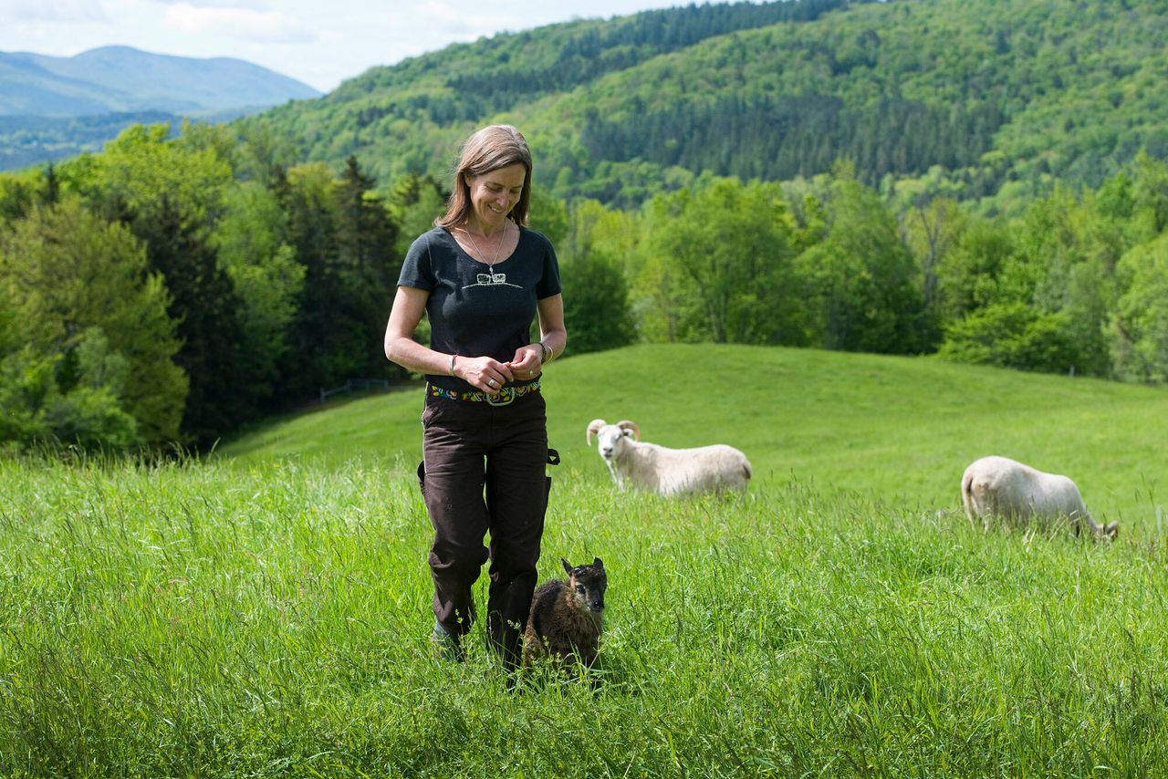 Helen Whybrow with an Icelandic lamb at Knoll Farm in Waitsfield, Vermont.