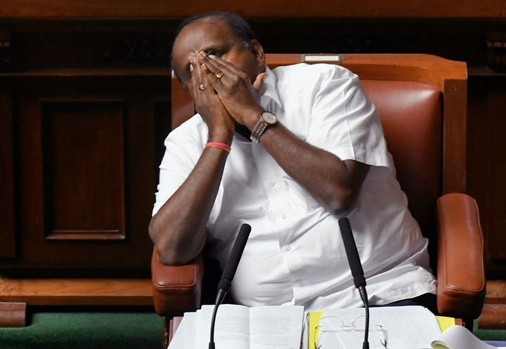 Chief Minister of Karnataka and senior Janatha Dal (Secular) leader Kumaraswamy yawns during the state legislative assembly session at the Vidhana Soudha, in Bangalore on July 23, 2019. 