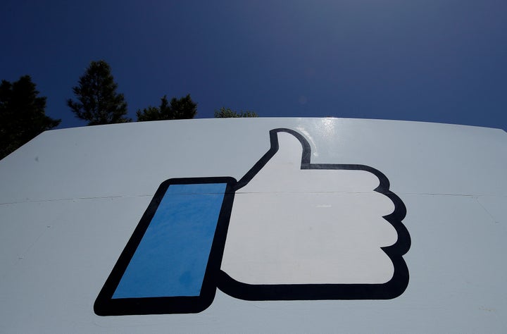 Facebook's thumbs-up Like logo is seen on a sign at Facebook's headquarters in Menlo Park, Calif.