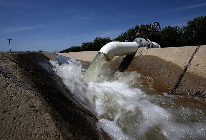 Water is pumped into an irrigation canal at an almond orchard in Firebaugh, California. It takes 3.2 gallons of water to grow just a single almond.