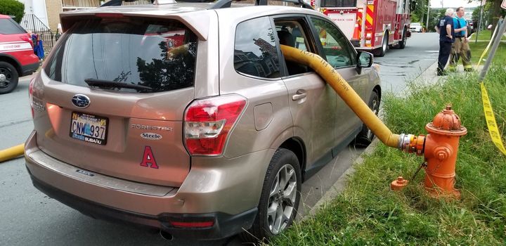 Firefighters smashed in the windows of a parked Subaru SUV in Halifax that blocked access to a fire hydrant.