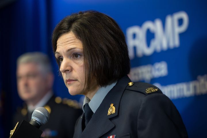 RCMP Sgt. Janelle Shoihet listens during a news conference in Surrey, B.C., on Tuesday.