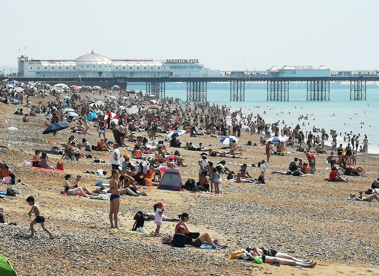 Basking in the hot weather on Brighton Beach on Thursday.