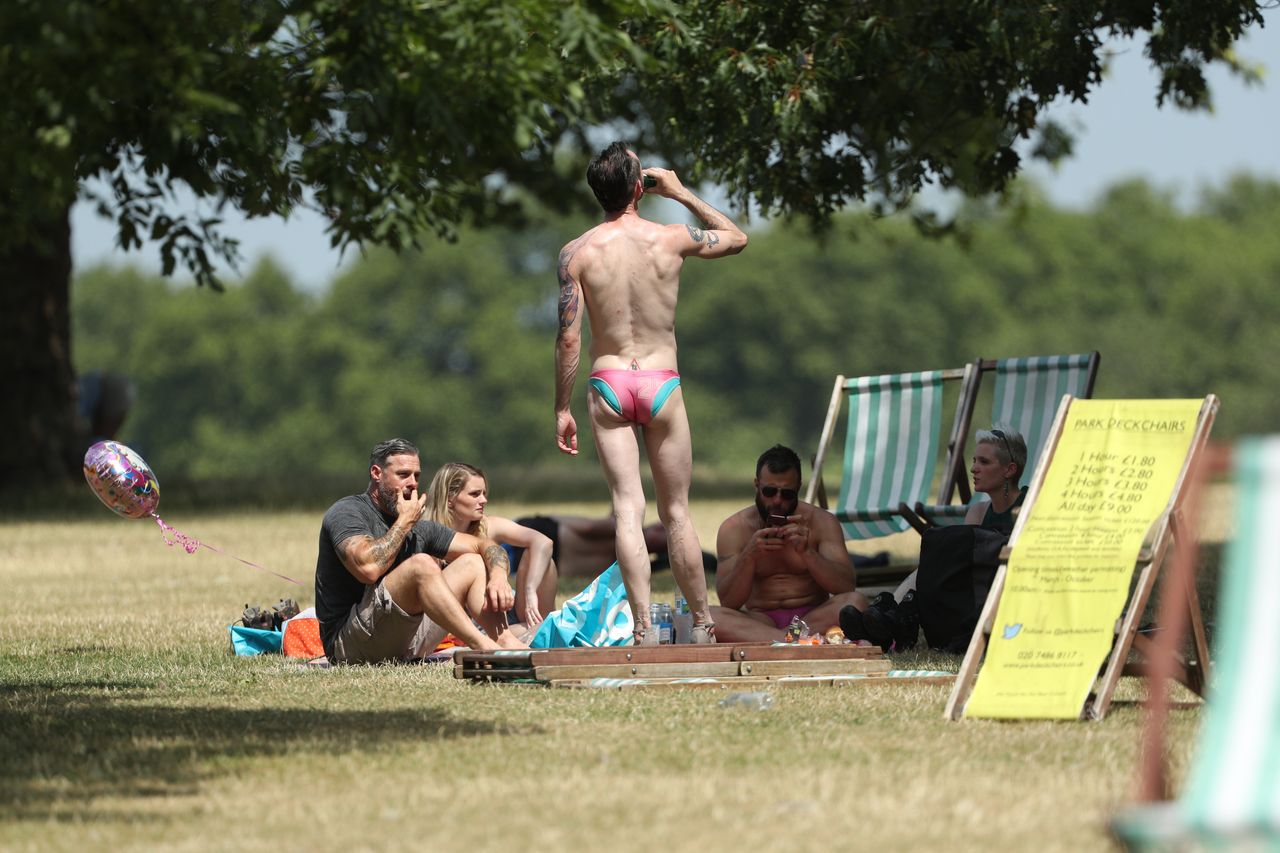 Stripping off in Hyde Park, London.